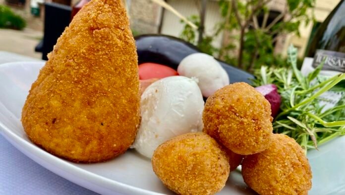 An essential part of Sicilian gastronomy, are arancini ultimately of Catalan origin?

