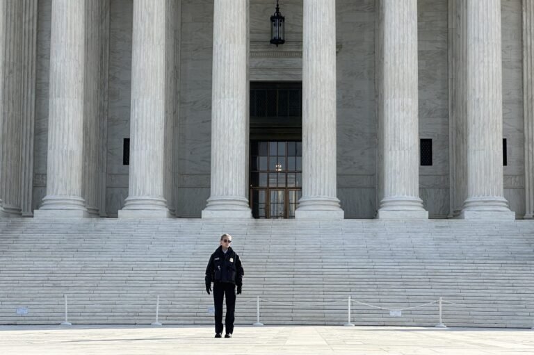 Police officer in front of court