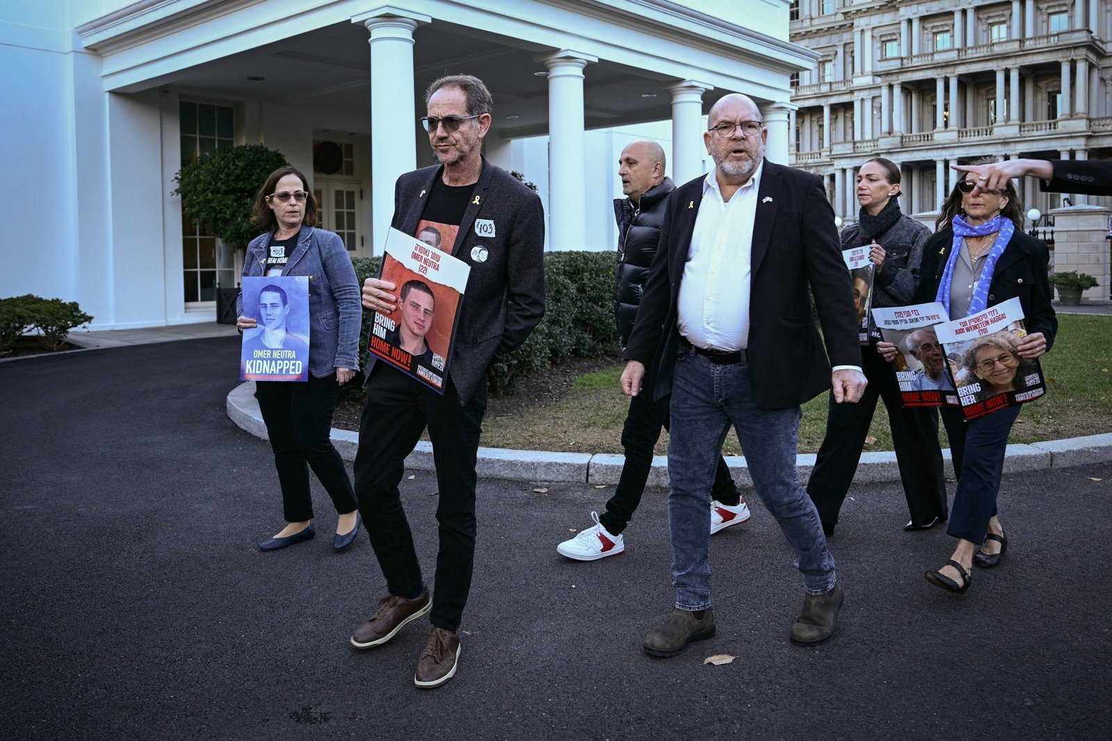 PHOTO: Orna Neutra (left) and Ronen Neutra (second left), parents of Omer Neutra, make a statement with other families of Americans held hostage by Hamas in front of the West Wing after a meeting with administration officials Nov. 12 . , 2024.