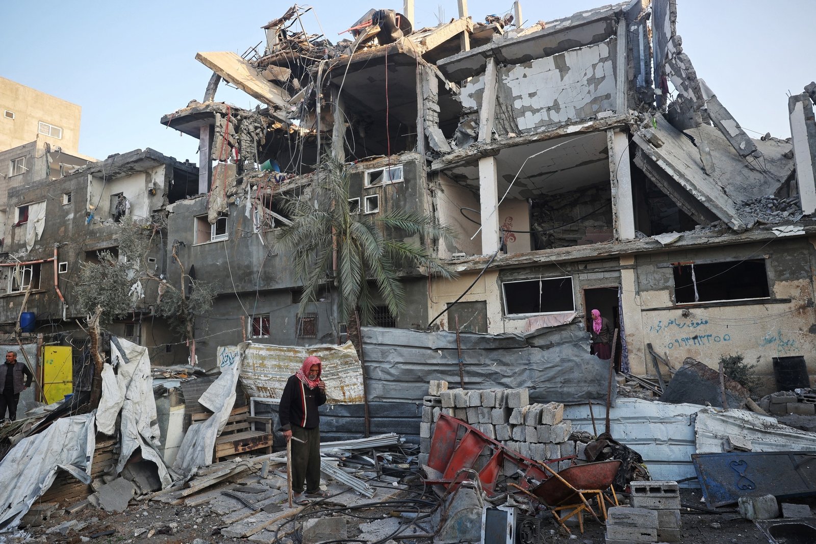 PHOTO: People search for their belongings amid the ruins of a destroyed building after an Israeli air strike on the Bureij camp for Palestinian refugees in the central Gaza Strip, January 6, 2025. 